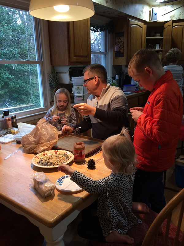 Dr. Turansky making bird feeders with grandkids.