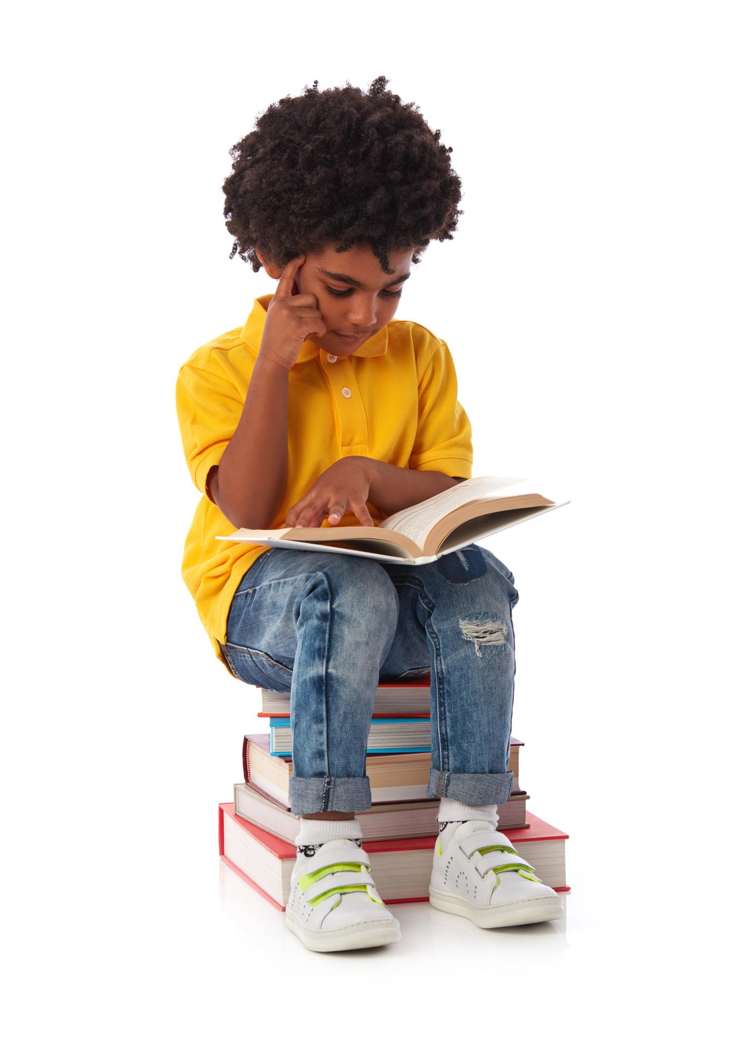 Thoughtful child reading book, learning and concentration